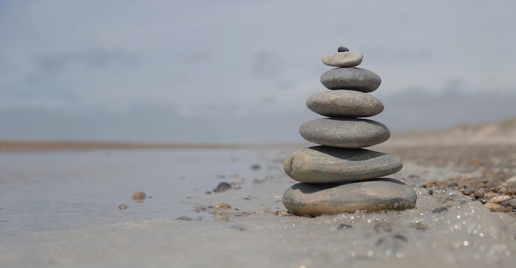 A meditative zen stone stack representing Zephyrwhale's frequently asked questions